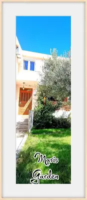 a picture of a house with a grass yard at Apartments Maris Garden in Petrovac na Moru