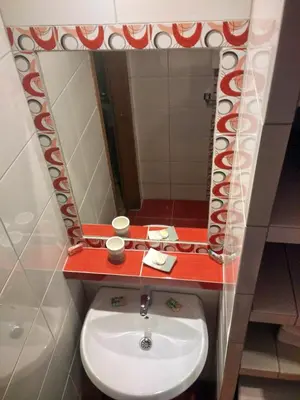 a bathroom with a sink and a mirror at Apartments Maris Garden in Petrovac na Moru