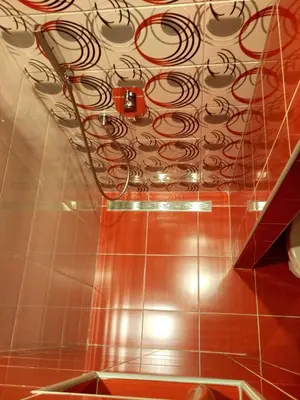a bathroom with a ceiling with a spiral at Apartments Maris Garden in Petrovac na Moru