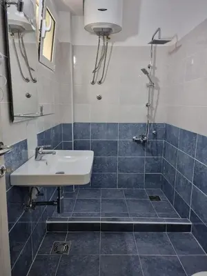 a bathroom with a sink and a shower at Apartments Vukmarković in Sutomore
