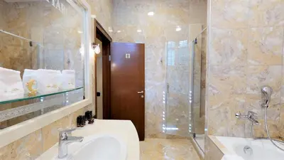 a bathroom with a sink and a shower at Historic Boutique Hotel Cattaro in Kotor