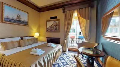 a hotel room with a bed with towels on it at Historic Boutique Hotel Cattaro in Kotor