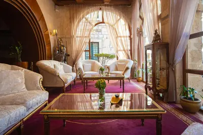 a living room with a couch and a table at Historic Boutique Hotel Cattaro in Kotor