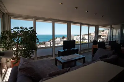 a living room with a view of the ocean at Hotel Freiburg in Ulcinj