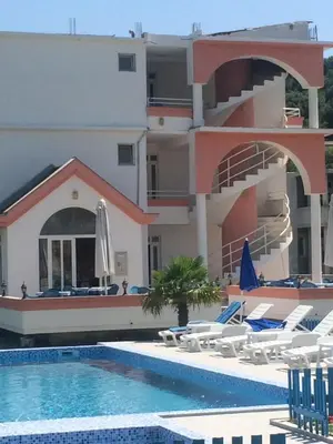 a view of a resort with a swimming pool at Guest House Green Garden in Ulcinj