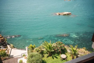 a view of the ocean from a balcony at Hotel Pirate Old Town in Ulcinj