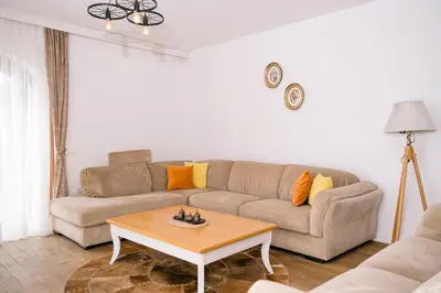 a living room with a couch and a coffee table at Hotel Pirate Old Town in Ulcinj