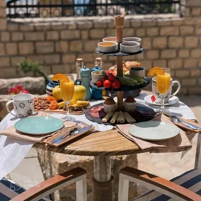 a table with a tray of food on it at Hotel Pirate Old Town in Ulcinj