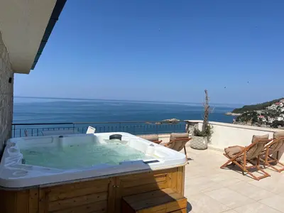 a jacuzzi tub on the patio of a house at Hotel Pirate Old Town in Ulcinj