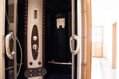 a room with a door open to a room with a control panel at Apartments Rudovic in Ulcinj