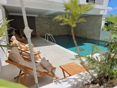 a swimming pool with two lounge chairs and a swimming pool at Marini Casa in Ulcinj