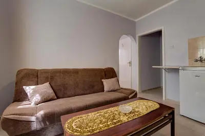 a living room with a couch and a coffee table at Do Re Mi Apartments in Budva