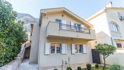 an image of a house with a balcony at Veron Apartments in Kotor