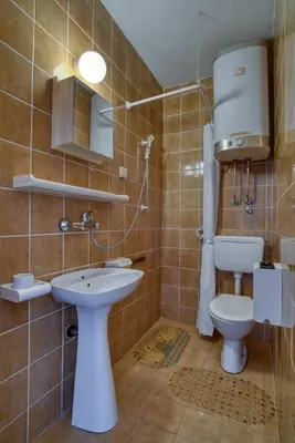 a bathroom with a toilet and a sink at Guest House Vukovic in Petrovac na Moru