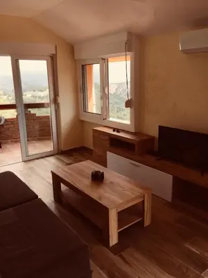 a living room with a couch and a coffee table at Apartments Bonaca in Budva