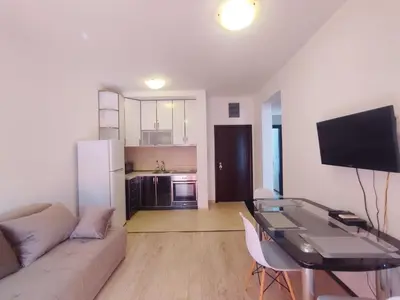 a living room with a couch and a glass table at Apartment Adrialux in Budva