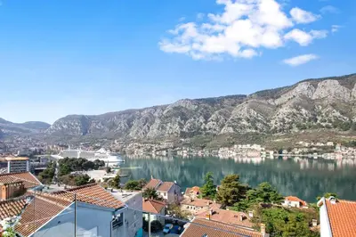 a view of a body of water with mountains at De Lux Apartments Sirena in Kotor