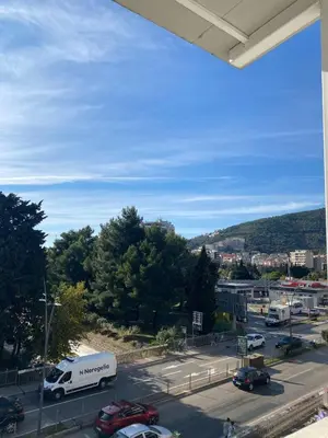 a view of a parking lot with a truck at Apartmani Bulevar in Budva