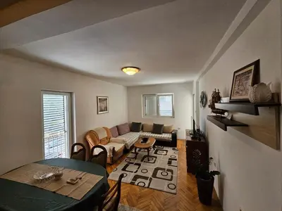 a living room with a couch and a table at Apartmani Bulevar in Budva
