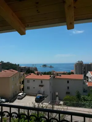 a view of the ocean from a balcony at De Luxe Apartment with a Seaview in Petrovac na Moru