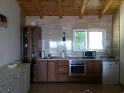 a kitchen with a stove and a window at De Luxe Apartment with a Seaview in Petrovac na Moru