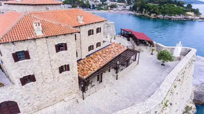an aerial view of a building next to the water at Kulla e Balshajve in Ulcinj