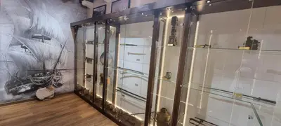 a display case in a room with a painting on the wall at Hotel Palata Venezia in Ulcinj