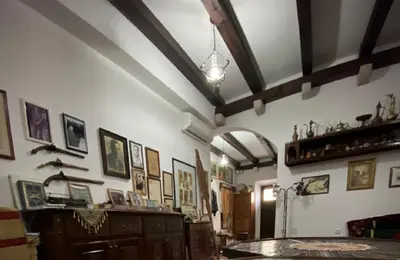 a living room with a lot of pictures on the walls at Hotel Palata Venezia in Ulcinj