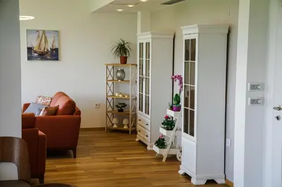 a living room with a couch and a chair at Apartments Bazar in Ulcinj