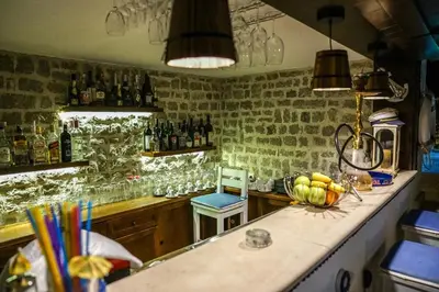 a kitchen with a counter with a bowl of bananas at Apartments Bazar in Ulcinj