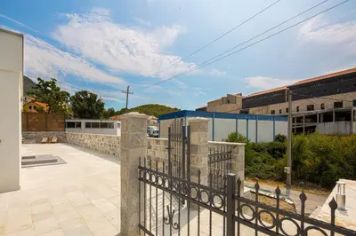 a balcony with a fence and a building at Villa Latina 2 in Budva