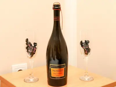 a bottle of wine on a table with two glasses at Apartments MIK5 - Famous Beach Jaz in Budva