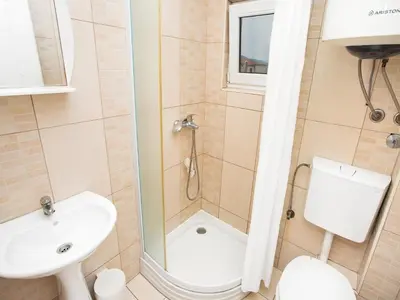 a bathroom with a shower and a toilet and a sink at Apartments MIK5 - Famous Beach Jaz in Budva