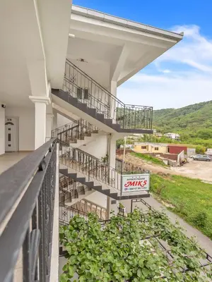 a building with stairs on the side of it at Apartments MIK5 - Famous Beach Jaz in Budva