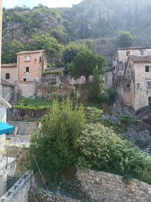 a group of buildings on top of a mountain at Guesthouse BiT Accommodation in Kotor