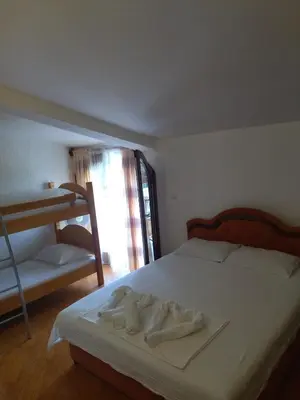 a bedroom with a bed with two towels on it at Apartment Klara in Bar