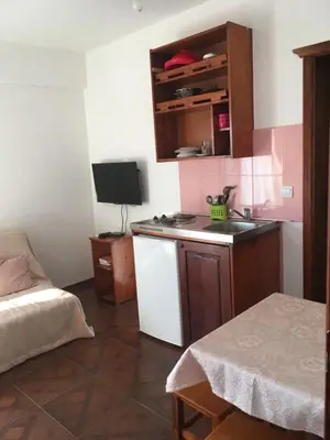 a small kitchen with a sink and a desk at Apartment Klara in Bar