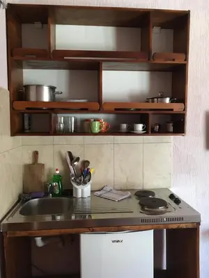 a kitchen with a sink and a counter top at Apartment Klara in Bar