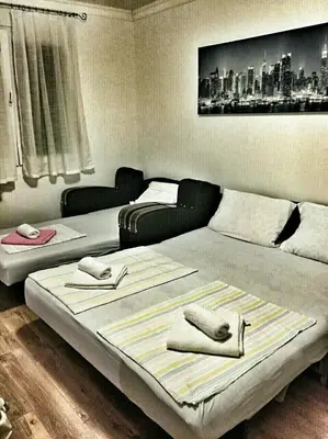 two beds with napkins on them in a room at Apartment Podkosljun in Budva