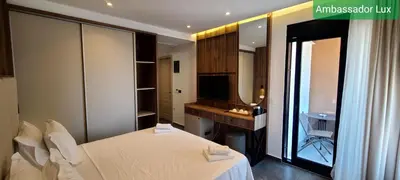 a bedroom with a bed and a mirror at Ambassador & Ambassador Lux Apartments in Ulcinj