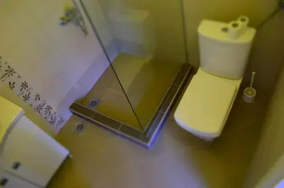 a small bathroom with a shower and a toilet at Apartments Stojanovic in Ulcinj