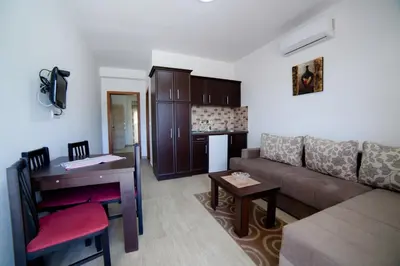 a living room with a couch and a table at Kollari Apartments in Ulcinj