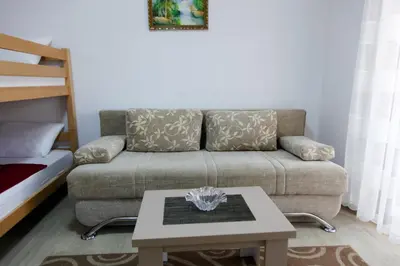 a living room with a couch and a coffee table at Kollari Apartments in Ulcinj