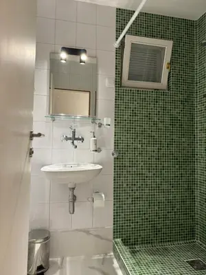 a bathroom with a sink and a mirror at Casablanca Apartments in Budva