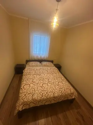 a bedroom with a bed and a window at Home Šćekić in Budva