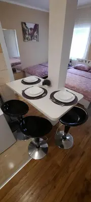 a table with four plates on it in a room at Home Šćekić in Budva