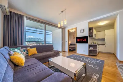 a living room with a couch and a table at Apt 