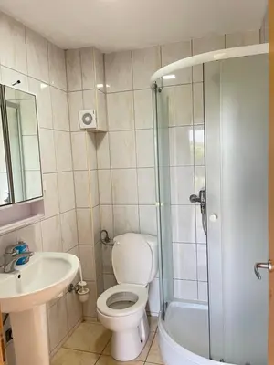 a bathroom with a toilet and a sink and a shower at Apartments Vali in Ulcinj