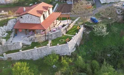an aerial view of a house with a stone wall at Village house - Novak Rijecani in Rijeka Crnojevića