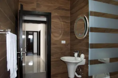 a bathroom with a sink and a mirror at Flo Apartments in Ulcinj